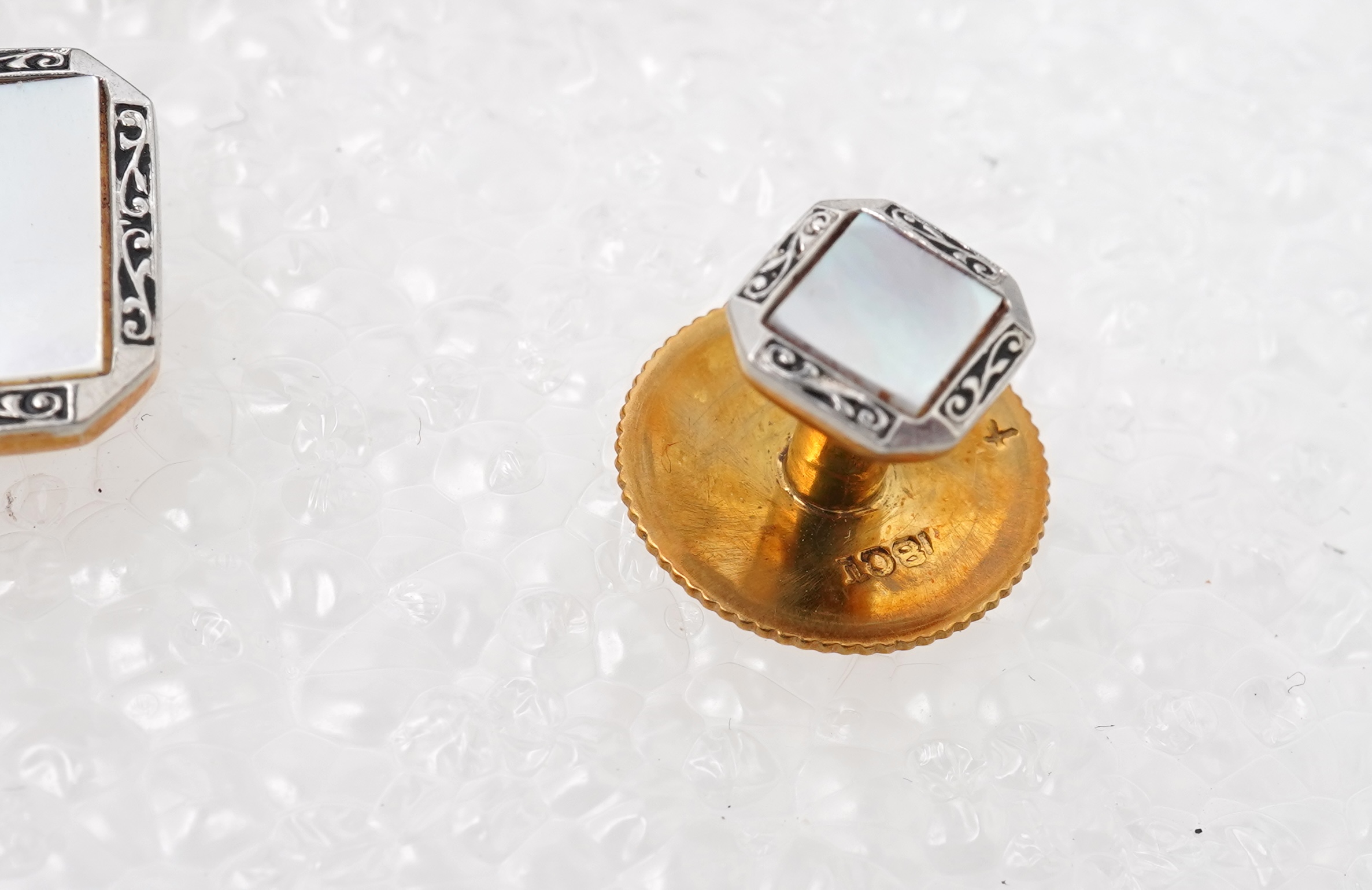 A mother of pearl dress set , early 20th century